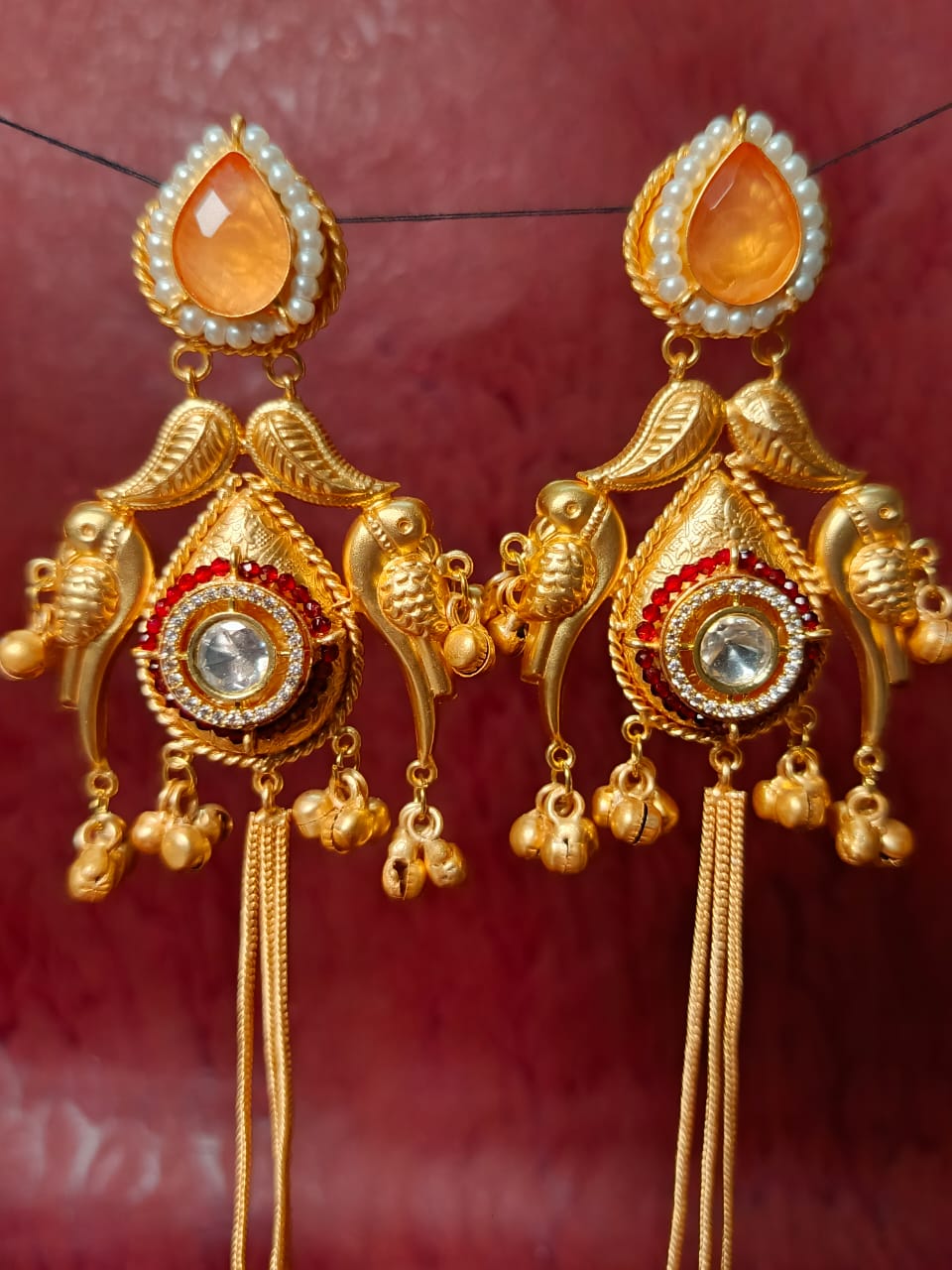 Intricate Bird Motif Brass Earrings with Dangling Chains